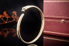 Panthère de Cartier Armreif Gelbgold 750 mit Onyx und Tsavorit Full Set 